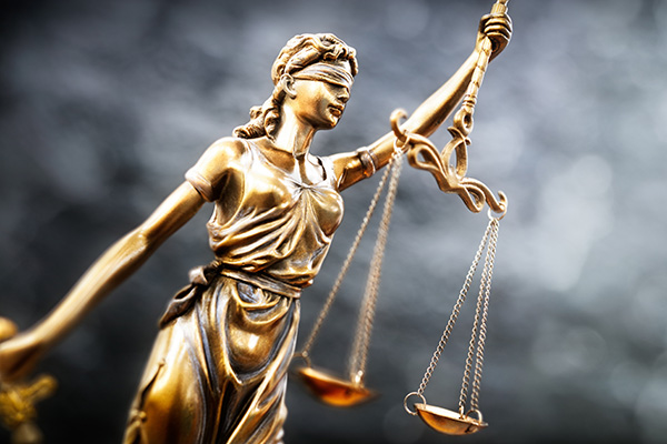 Legal law concept statue of Lady Justice with scales of justice