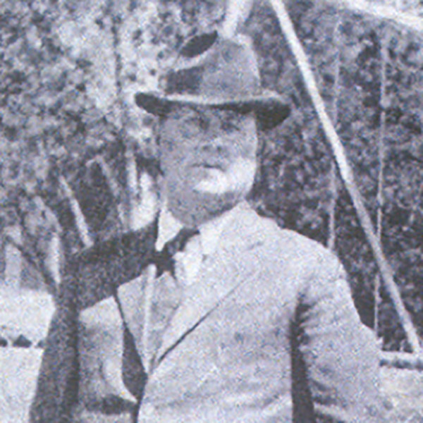 Constable Arthur McDonald wears a hat and suit.