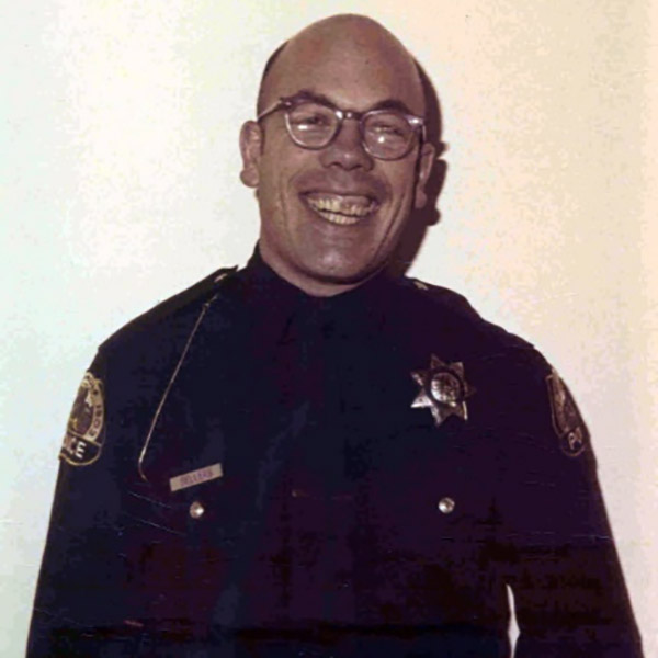 Patrolman John Mueller Sellers smiles in uniform.