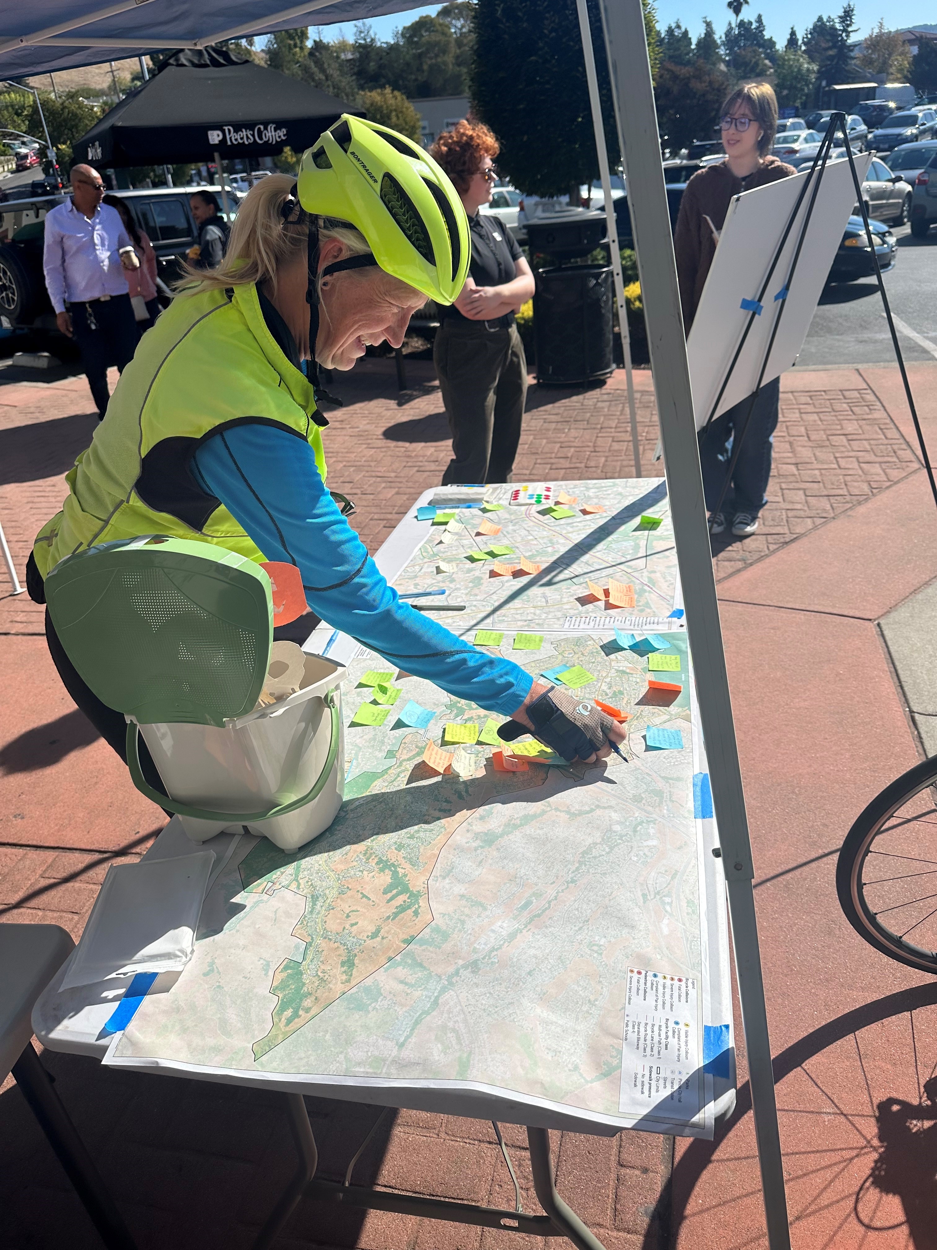 Biker marking dots on a map 