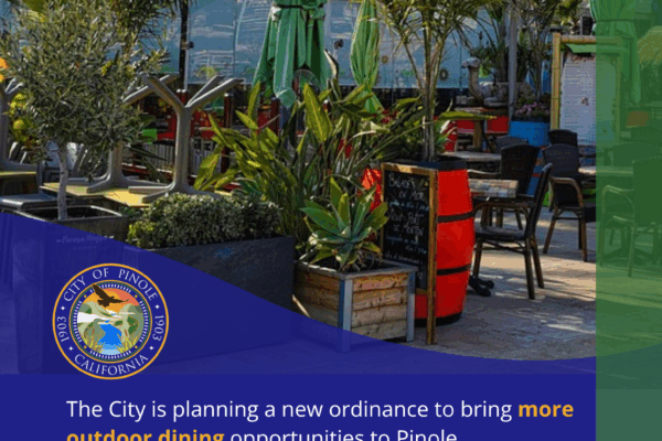outdoor restaurant tables and greenery on a blue background