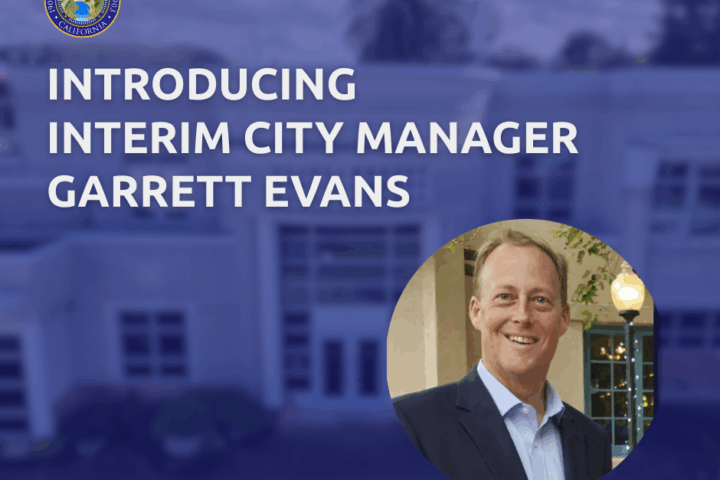 blue graphic and man with blonde hair in suit