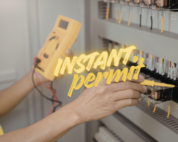 A close-up of an electric vehicle with a charging connector plugged into the charging port, with trees visible in the background and the words “INSTANT permit” overlaid in yellow text.