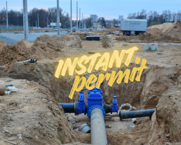 An open trench at a construction site containing large underground pipes connected to a blue valve assembly, with soil mounds and construction equipment in the background. The words “INSTANT permit” appear in yellow stylized text across the center.