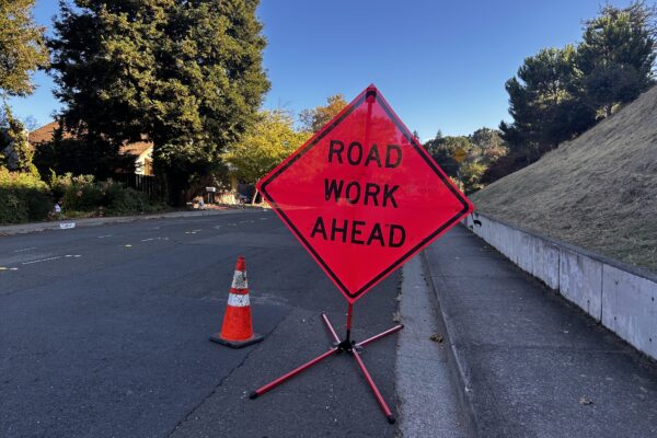 road work ahead orange sign